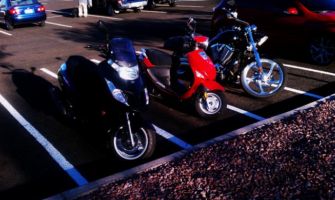 Two scoots in the MC parking? Oh, the humanity!