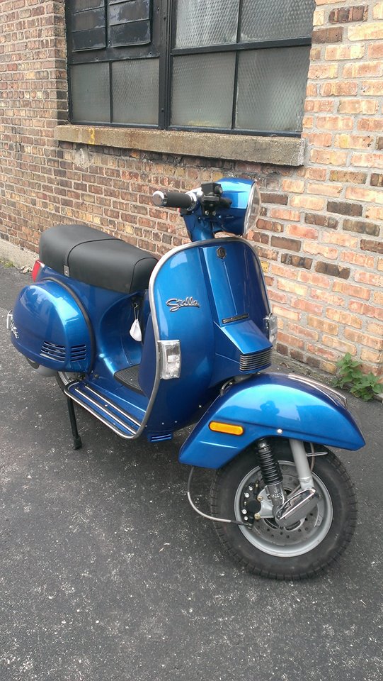 Note the extra vents in the cowls, lack of brake pedal, and vents under the legshield. (From Scooterworks Chicago's Facebook)