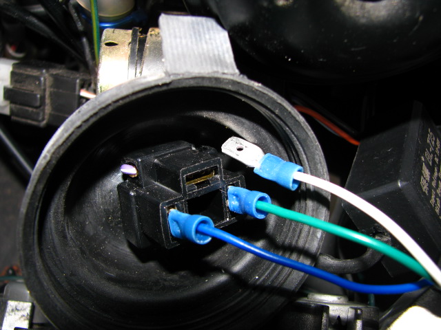 Electrical connection to scooter wire harness. That black block thing is the original connector that was plugged onto the original halogen bulb.