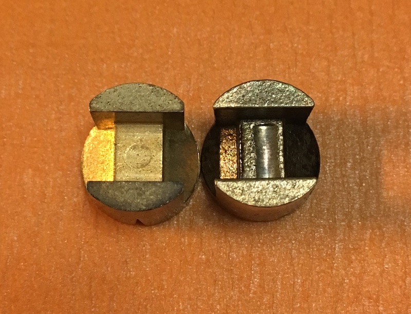 Actuating pad showing wear (R) compared to new (L)