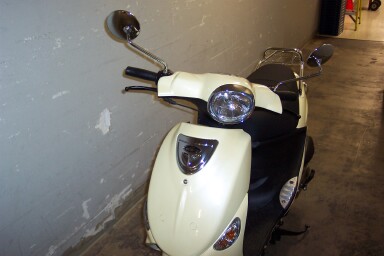 and a pic of buddy de-badged, dot signals removed, rear chrome rack added.