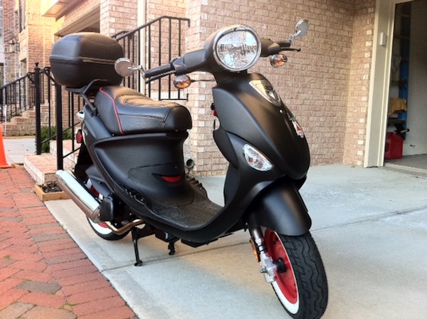 Red L.E.D.s under lighting. Custom seat. Chrome bar-end mirrors Givi hard case wired with brake lights and a painted engine vent.