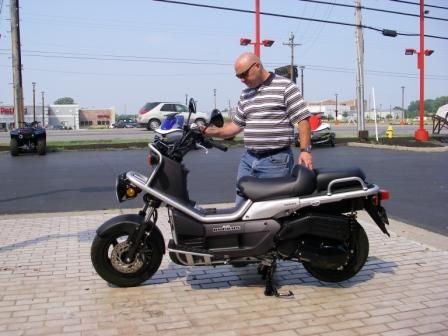 6-18-07 Ben checking out the Big Ruckus Scootersmall.jpg