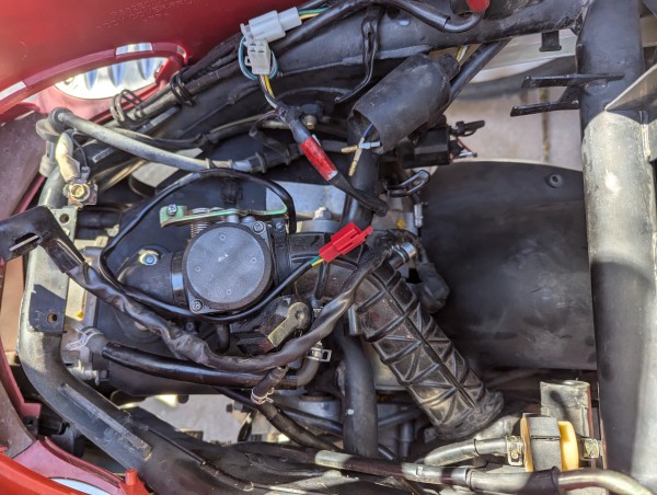 Everything except the oil cooler, shock and engine hanger are disconnected.