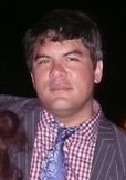 Pinstripe jacket, plaid shirt, floral tie, drunk face. Equally (or more) drunk people cropped out!