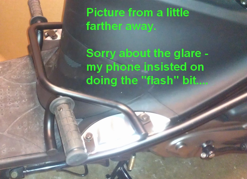 How foot pegs attach-farther away.jpg