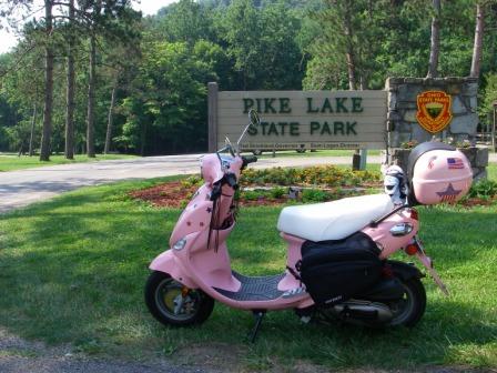 07-07 through 09 - 07  Buddy in front of the Pike Lake sign. Pike Lake State Park, Bainbridge, OHsmall.jpg