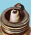 A spark plug that is too white indicates the engine is running too lean.