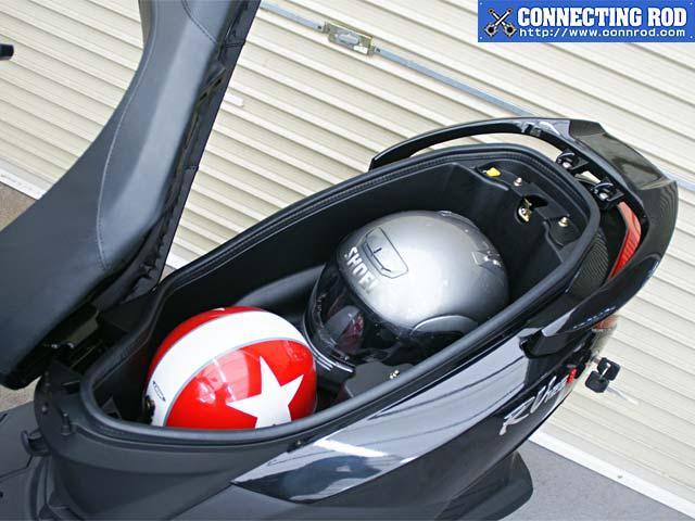 Lotta space, but a weird seat hinge. Notice the protrusion on the left wall, between the helmets too.